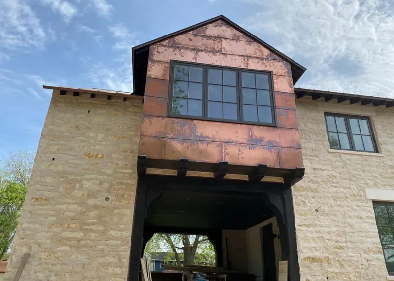 Copper metal panel facade on a stone building for Roof Repair in Lemoore
